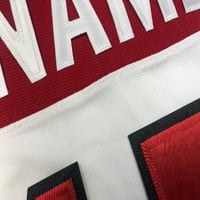 Crvena i bijela hokejaška dresova sa logotipom Johnny Canuck