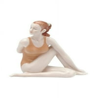 Porculanska figurica obavlja yoga kičmu uvijanja